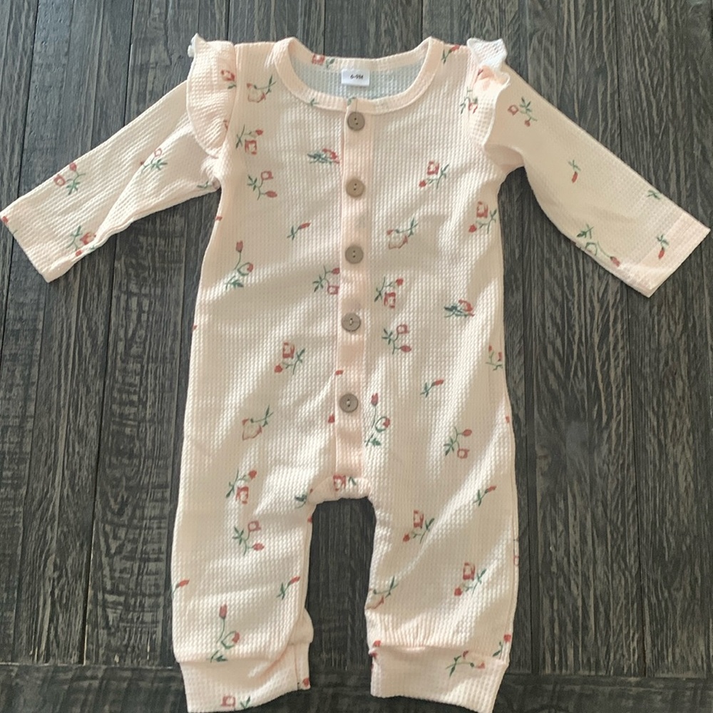 Beige baby jumpsuit.